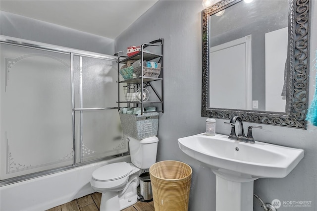 223 Nugget Rd, Gold Bar, WA 98251 - bathroom featuring shower / bath combination with glass door and wood finished floors