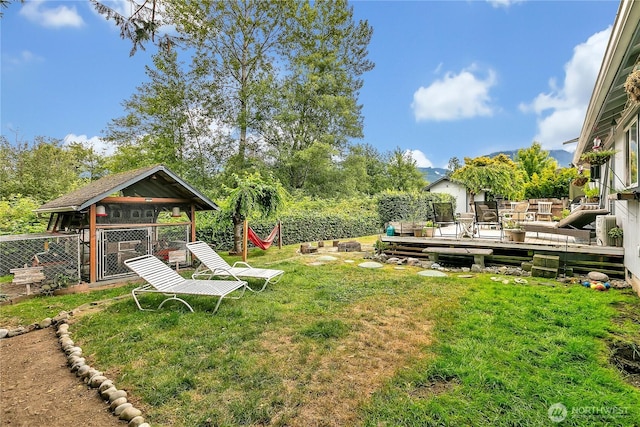 223 Nugget Rd, Gold Bar, WA 98251 - view of green lawn featuring a deck and an outdoor structure