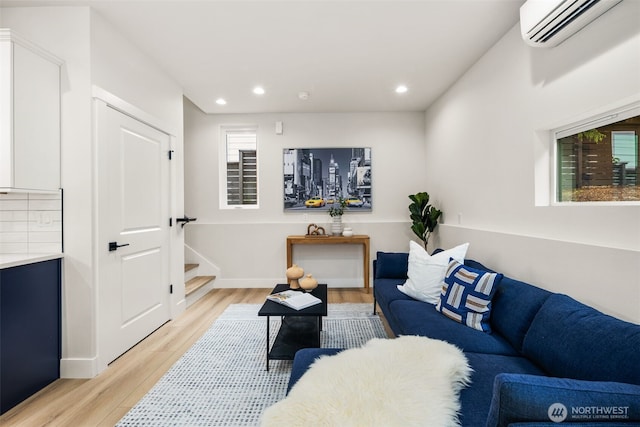 9692 51st Ave S, Seattle, WA 98118 - living area with a wall unit AC, light wood-style floors, recessed lighting, and stairway