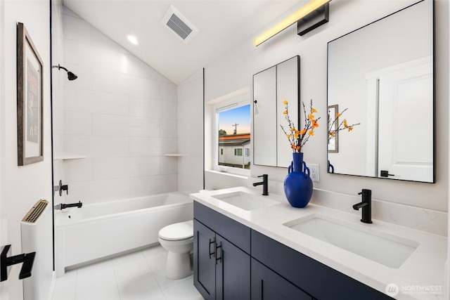 9692 51st Ave S, Seattle, WA 98118 - full bath featuring lofted ceiling, double vanity, bathtub / shower combination, and tile patterned flooring
