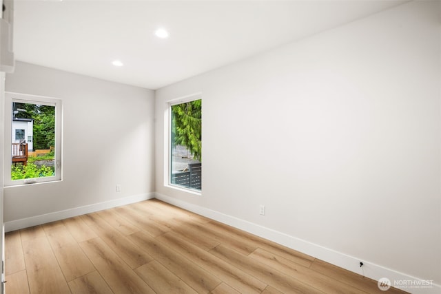 9692 51st Ave S, Seattle, WA 98118 - empty room with light wood-style flooring and recessed lighting
