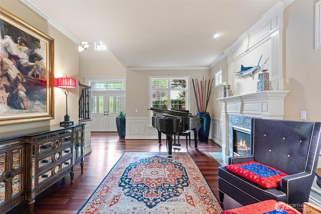4569 162nd Ln SE, Bellevue, WA 98006 - living room with ornamental molding, dark wood-style floors, a decorative wall, a wainscoted wall, and a high end fireplace