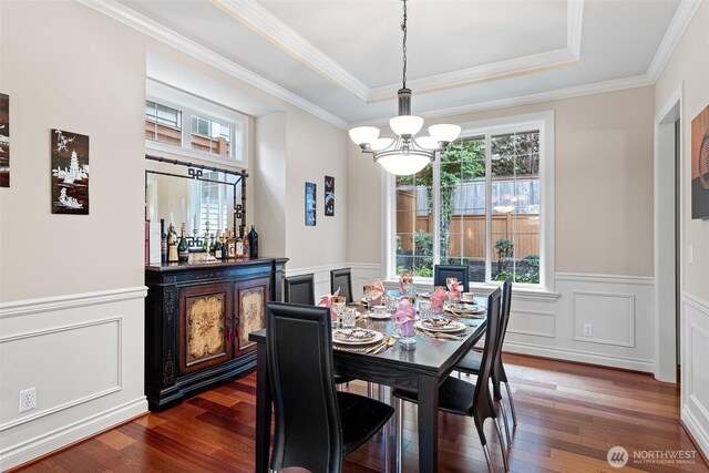4569 162nd Ln SE, Bellevue, WA 98006 - dining room featuring healthy amount of natural light, a wainscoted wall, dark wood-style floors, a chandelier, and a decorative wall