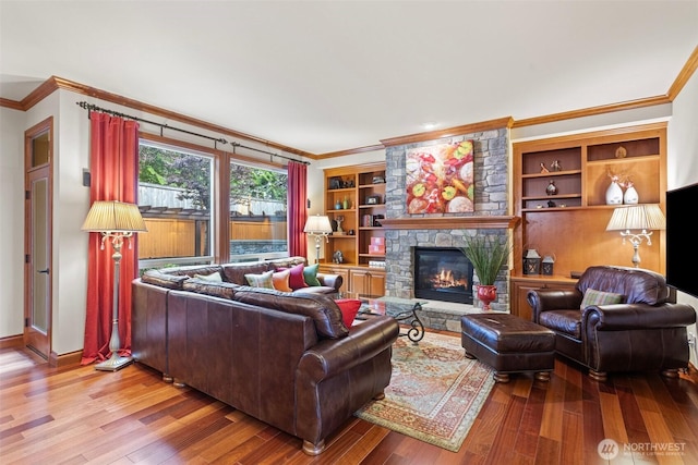 4569 162nd Ln SE, Bellevue, WA 98006 - living area with crown molding, wood finished floors, and a stone fireplace