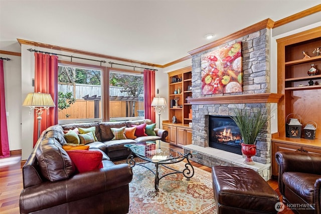 4569 162nd Ln SE, Bellevue, WA 98006 - living area with crown molding, wood finished floors, and a fireplace