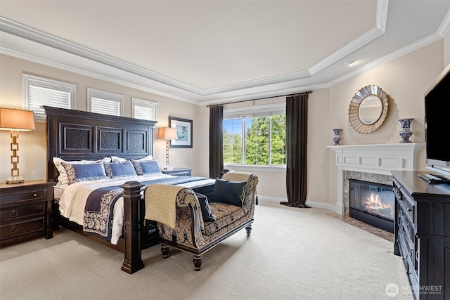 4569 162nd Ln SE, Bellevue, WA 98006 - bedroom with a raised ceiling, light carpet, ornamental molding, and a high end fireplace