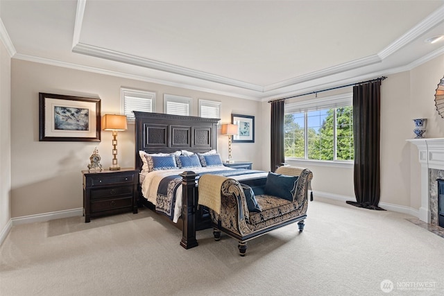 4569 162nd Ln SE, Bellevue, WA 98006 - bedroom with light colored carpet, ornamental molding, a high end fireplace, and a raised ceiling