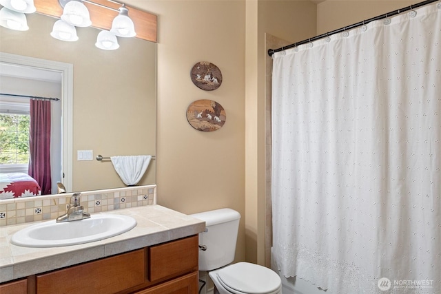 4569 162nd Ln SE, Bellevue, WA 98006 - full bathroom featuring vanity, decorative backsplash, and shower / bath combo with shower curtain