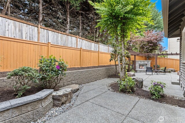 4569 162nd Ln SE, Bellevue, WA 98006 - fenced backyard featuring a patio area