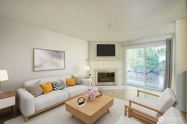 421 S 321st Pl Unit C4, Federal Way, WA 98003 - living room with a textured ceiling and a tile fireplace