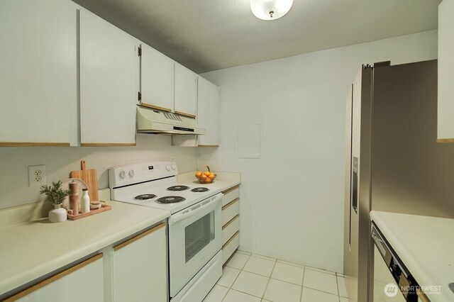 421 S 321st Pl Unit C4, Federal Way, WA 98003 - kitchen featuring white appliances, under cabinet range hood, light countertops, and light tile patterned floors
