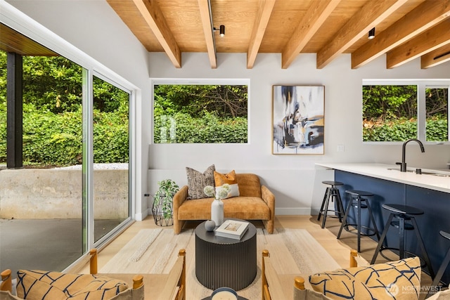 9694 51st Ave S, Seattle, WA 98118 - living area featuring a wood ceiling with exposed beams and light wood-type flooring