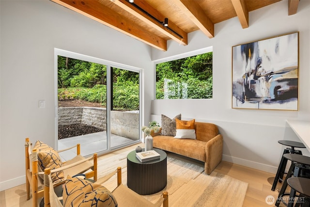 9694 51st Ave S, Seattle, WA 98118 - sitting room with beam ceiling and wood finished floors