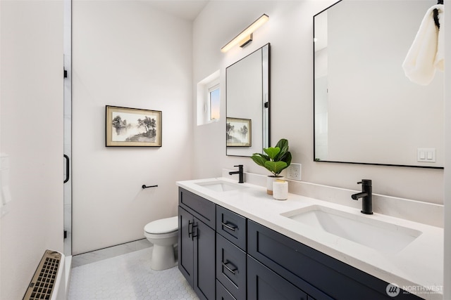 9694 51st Ave S, Seattle, WA 98118 - bathroom featuring double vanity and tile patterned floors