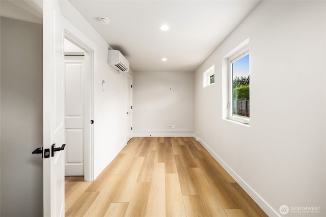 9694 51st Ave S, Seattle, WA 98118 - corridor featuring a wall unit AC, light wood-style flooring, and recessed lighting