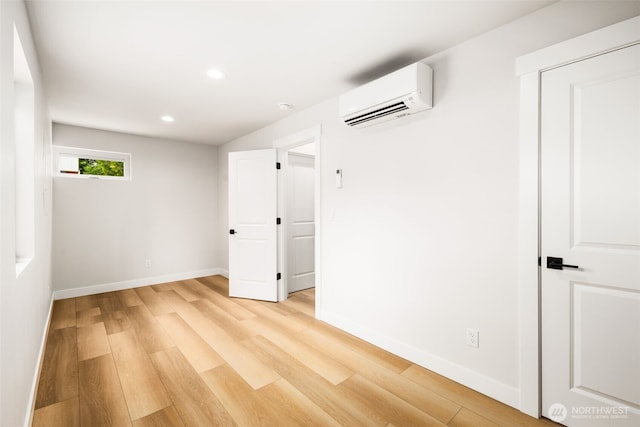 9694 51st Ave S, Seattle, WA 98118 - empty room featuring an AC wall unit, light wood-style floors, and recessed lighting