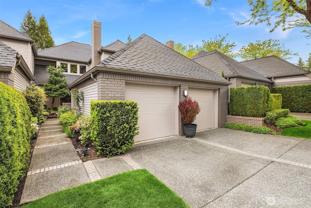 1732 Bellevue Way NE, Bellevue, WA 98004 - view of front of home featuring a chimney, a garage, driveway, and brick siding