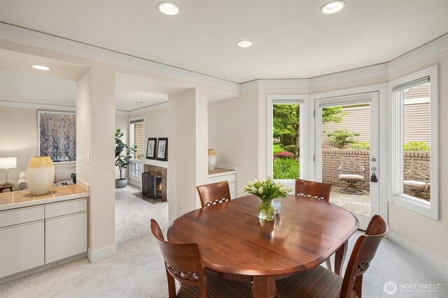 1732 Bellevue Way NE, Bellevue, WA 98004 - dining space with light colored carpet, recessed lighting, and a high end fireplace