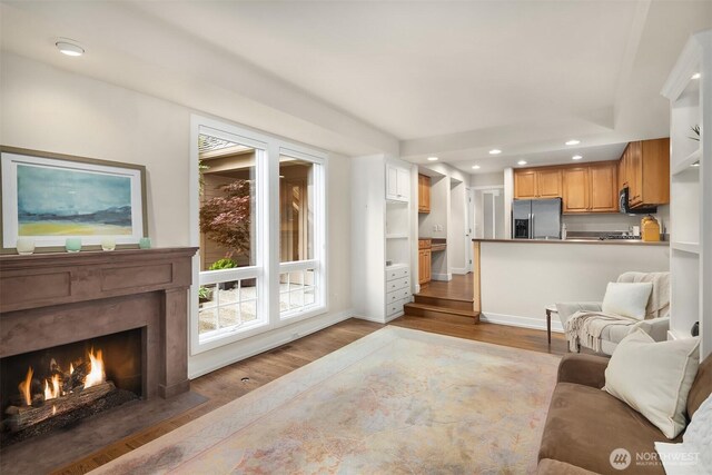1732 Bellevue Way NE, Bellevue, WA 98004 - living room featuring wood finished floors, a high end fireplace, and recessed lighting