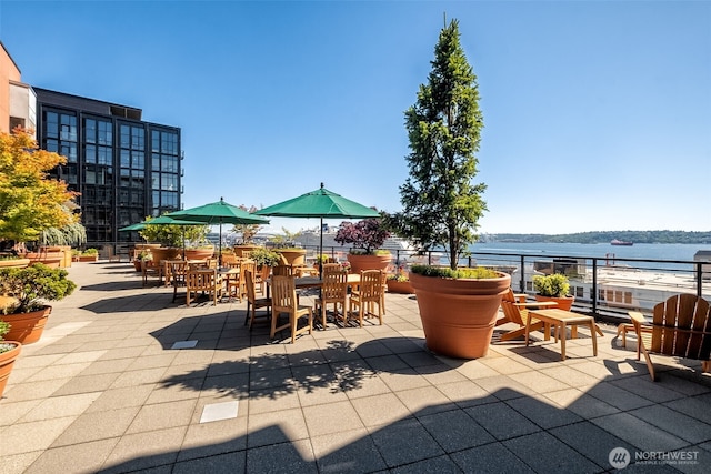 2607 Western Ave Unit 655, Seattle, WA 98121 - view of patio / terrace with a water view and outdoor dining area