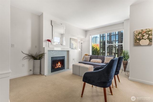 2607 Western Ave Unit 655, Seattle, WA 98121 - living area with a tile fireplace and light colored carpet