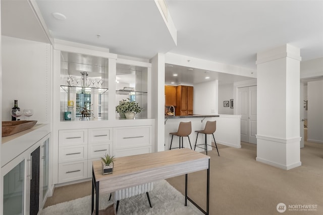 2607 Western Ave Unit 655, Seattle, WA 98121 - home office featuring light colored carpet, a bar, and recessed lighting