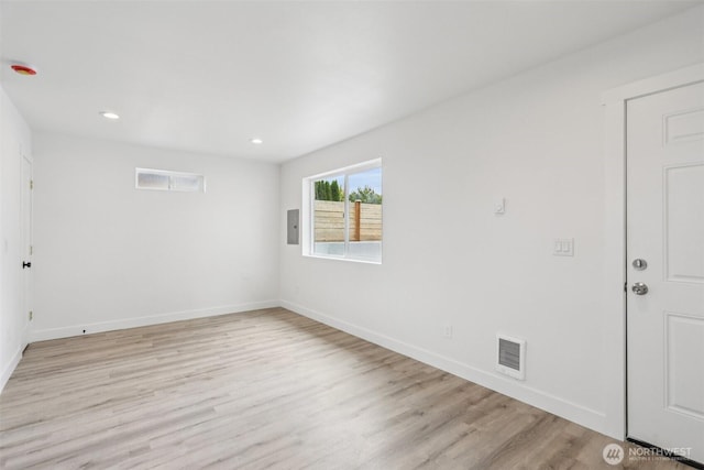 3102 44th Ave NE, Tacoma, WA 98422 - spare room featuring light wood-style floors, electric panel, and recessed lighting