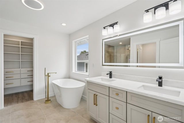 3102 44th Ave NE, Tacoma, WA 98422 - full bath featuring double vanity, a stall shower, a freestanding tub, tile patterned floors, and a walk in closet