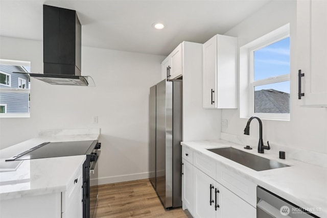 3102 44th Ave NE, Tacoma, WA 98422 - kitchen with appliances with stainless steel finishes, wall chimney exhaust hood, light wood-type flooring, white cabinetry, and recessed lighting