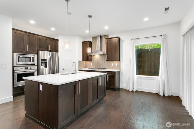 4214 223rd Pl SE, Bothell, WA 98021 - kitchen with appliances with stainless steel finishes, wall chimney range hood, dark brown cabinets, light countertops, and tasteful backsplash
