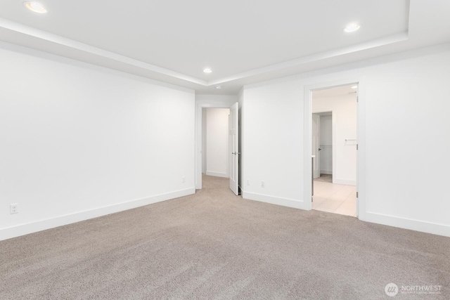 4214 223rd Pl SE, Bothell, WA 98021 - unfurnished bedroom with light colored carpet, recessed lighting, and a tray ceiling