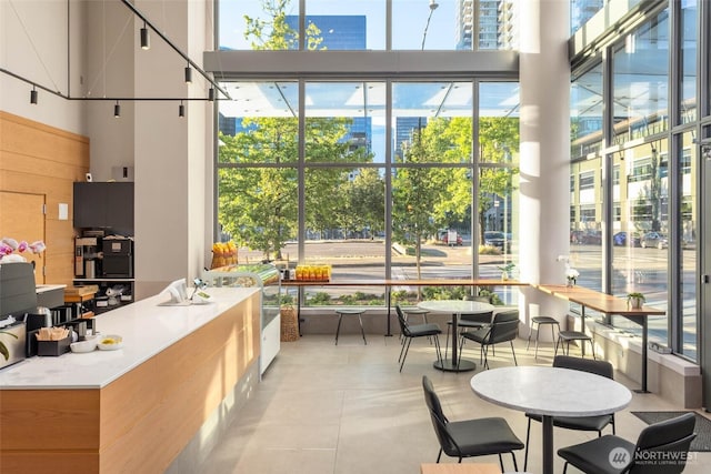 2510 6th Ave Unit 2809, Seattle, WA 98121 - dining area featuring a towering ceiling and light tile patterned floors