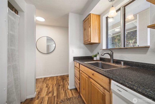 6819 Braker Way, Lynden, WA 98264 - kitchen featuring white dishwasher, dark countertops, wood finished floors, and decorative light fixtures