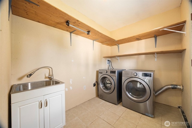 6819 Braker Way, Lynden, WA 98264 - laundry room with cabinet space, washing machine and clothes dryer, and light tile patterned floors