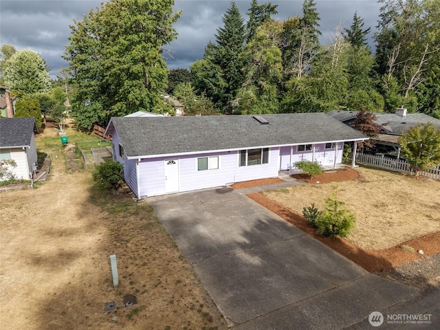 900 Dundee Rd NW, Olympia, WA 98502 - single story home with asphalt driveway, a porch, and roof with shingles