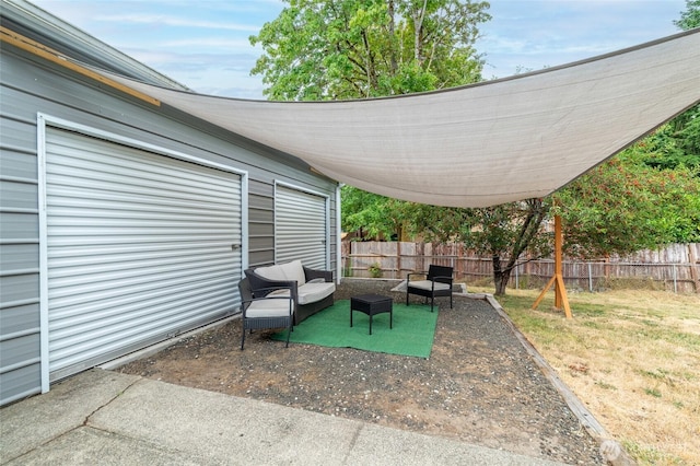 900 Dundee Rd NW, Olympia, WA 98502 - fenced backyard featuring a patio area and outdoor lounge area