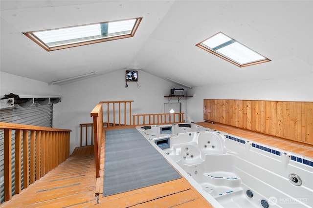 900 Dundee Rd NW, Olympia, WA 98502 - additional living space featuring a skylight, vaulted ceiling, and wood finished floors