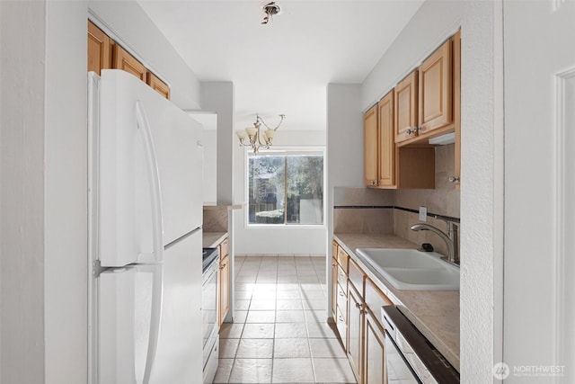14510 124th Ave NE Unit H79, Kirkland, WA 98034 - kitchen featuring freestanding refrigerator, dishwasher, a chandelier, light countertops, and stove