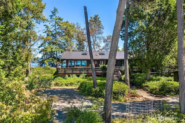 512 Broken Point Rd, Shaw Island, WA 98286 - view of front of property featuring a deck, a standing seam roof, and a metal roof