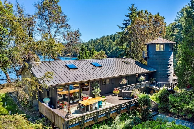 512 Broken Point Rd, Shaw Island, WA 98286 - rear view of house featuring a standing seam roof, a wooden deck, and a metal roof