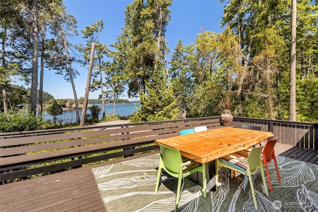 512 Broken Point Rd, Shaw Island, WA 98286 - deck featuring outdoor dining area, a water view, and view of wooded area