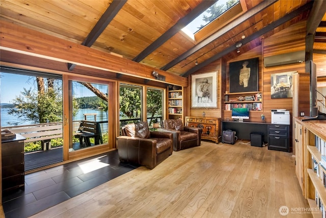 512 Broken Point Rd, Shaw Island, WA 98286 - living area with wood walls, wood finished floors, wooden ceiling, and a skylight