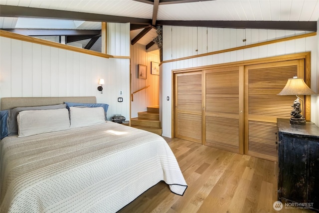 512 Broken Point Rd, Shaw Island, WA 98286 - bedroom with light wood-style floors, wood walls, and a closet