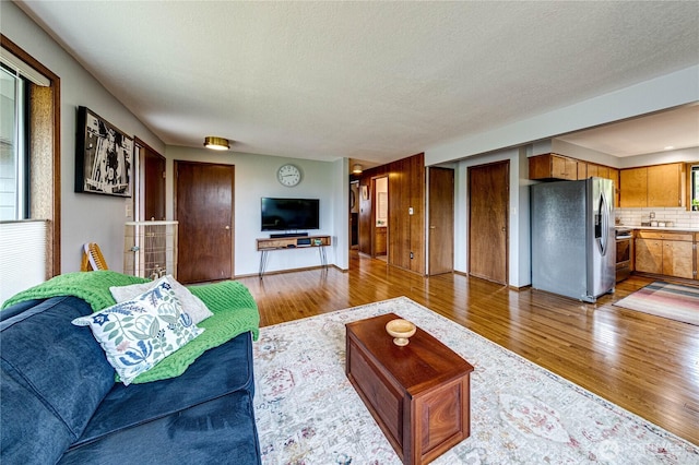 1121 W 12th St, Port Angeles, WA 98363 - living area with wood finished floors and a textured ceiling