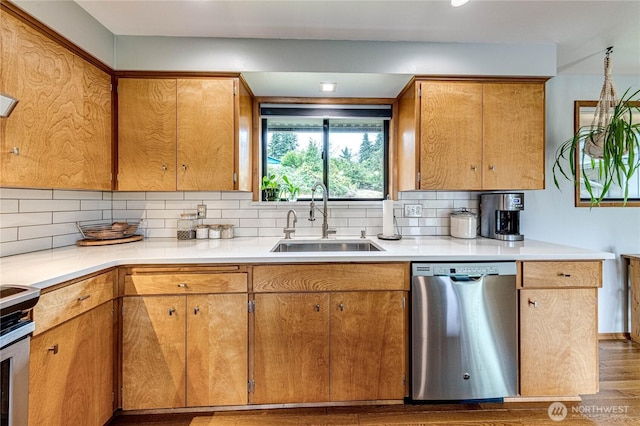 1121 W 12th St, Port Angeles, WA 98363 - kitchen featuring stainless steel dishwasher, tasteful backsplash, wood finished floors, stove, and light countertops