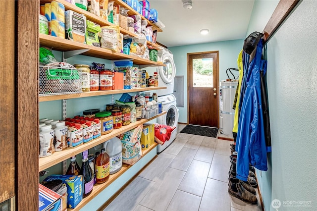 1121 W 12th St, Port Angeles, WA 98363 - pantry with water heater and stacked washer and clothes dryer