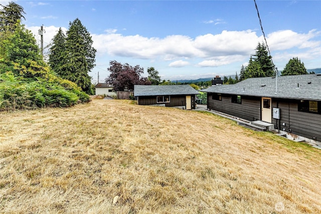 1121 W 12th St, Port Angeles, WA 98363 - view of grassy yard with an outdoor structure