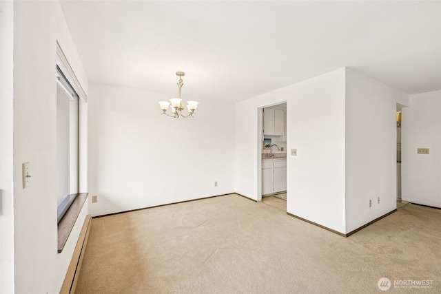 516 S 222nd St Unit 4, Des Moines, WA 98198 - spare room featuring light carpet and a chandelier