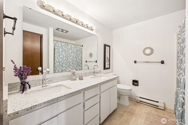 516 S 222nd St Unit 4, Des Moines, WA 98198 - full bathroom with baseboard heating, double vanity, a shower with shower curtain, and tile patterned flooring