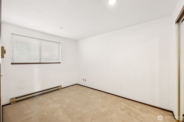 516 S 222nd St Unit 4, Des Moines, WA 98198 - spare room with baseboard heating and carpet